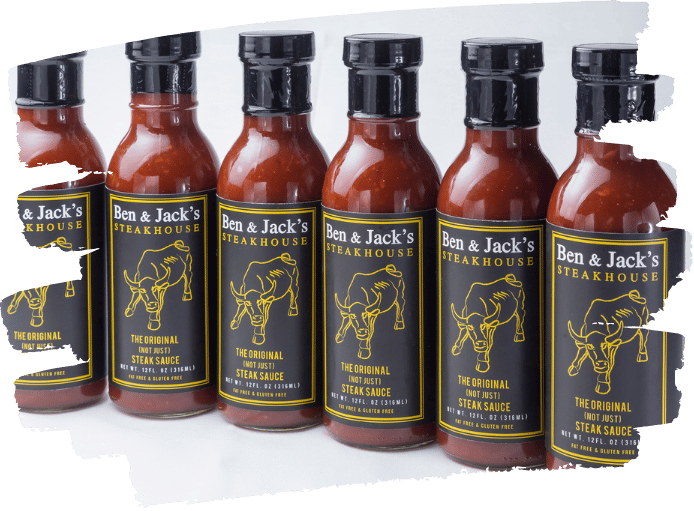 Lineup of Ben & Jack’s Steakhouse sauce bottles with black and yellow bull logo labels